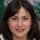 Image of a woman smiling to the camera