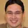 Image of a man smiling to the camera